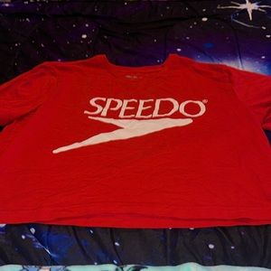 Red crop top. The brand is Speedo. It’s an XL.